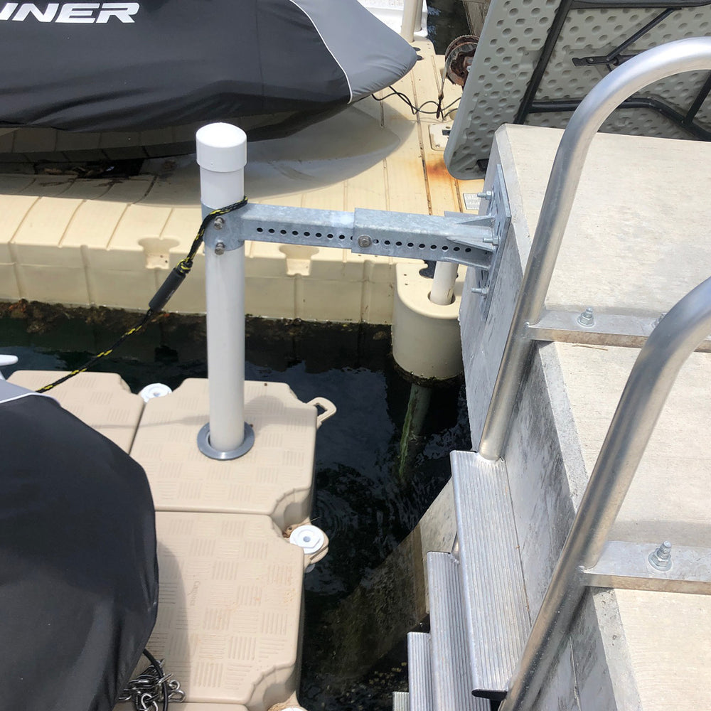 Galvanized steel adjustable pile support for 2-7/8" pipes, ensuring secure dock installation and resilience in different water levels.