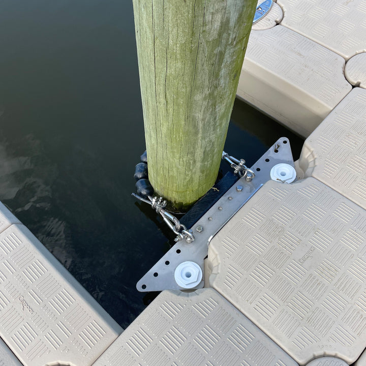 Roller-based adjustable pile guide with stainless steel cables, providing flexible and secure dock positioning.