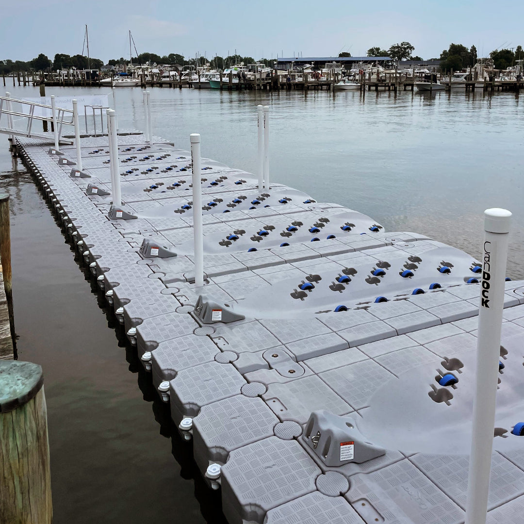 Candock JetRoll Dock - Single-piece, foam-filled MDPE dock for personal watercraft. Features 12 urethane wheels for customizable positioning. Dimensions: 3.86m x 1.93m x 30.5cm, weight 159 kg.