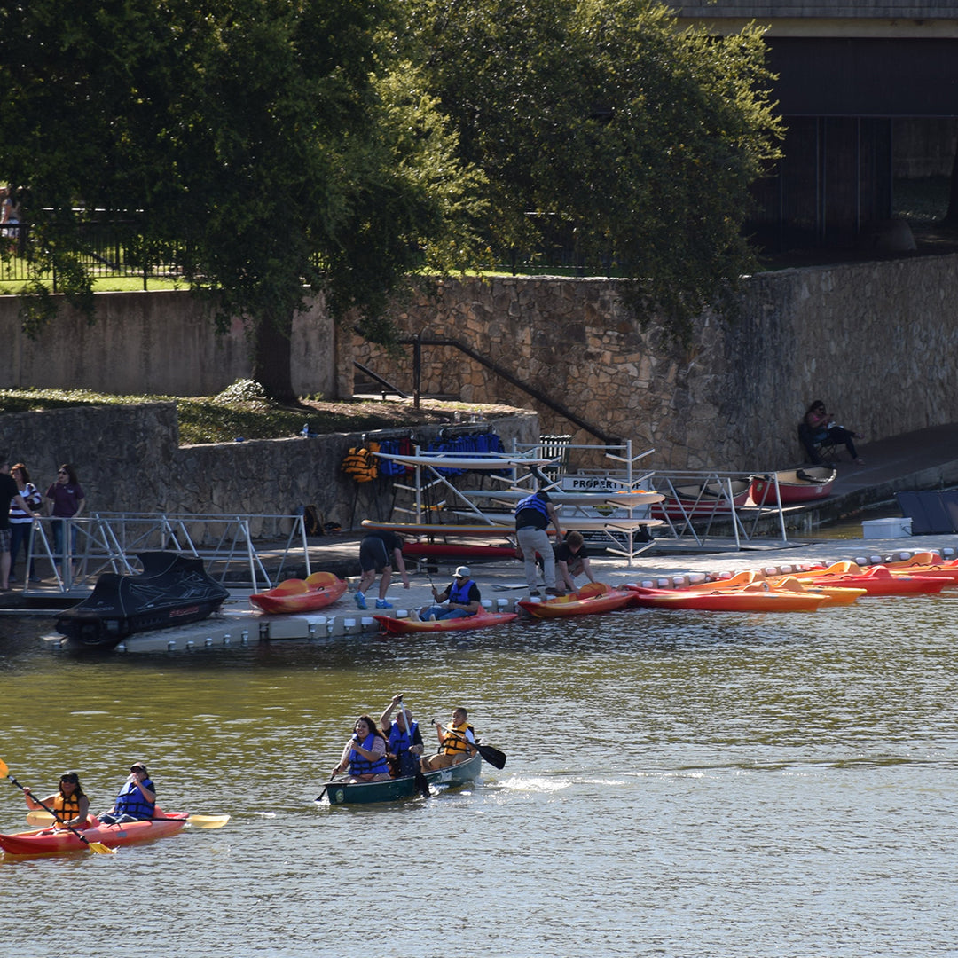 Modular kayak rack for securing kayaks, canoes, or SUPs. Customizable to fit different activities and family needs